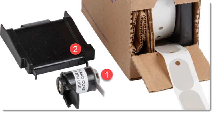 Remove the core spool and label ramp from the box